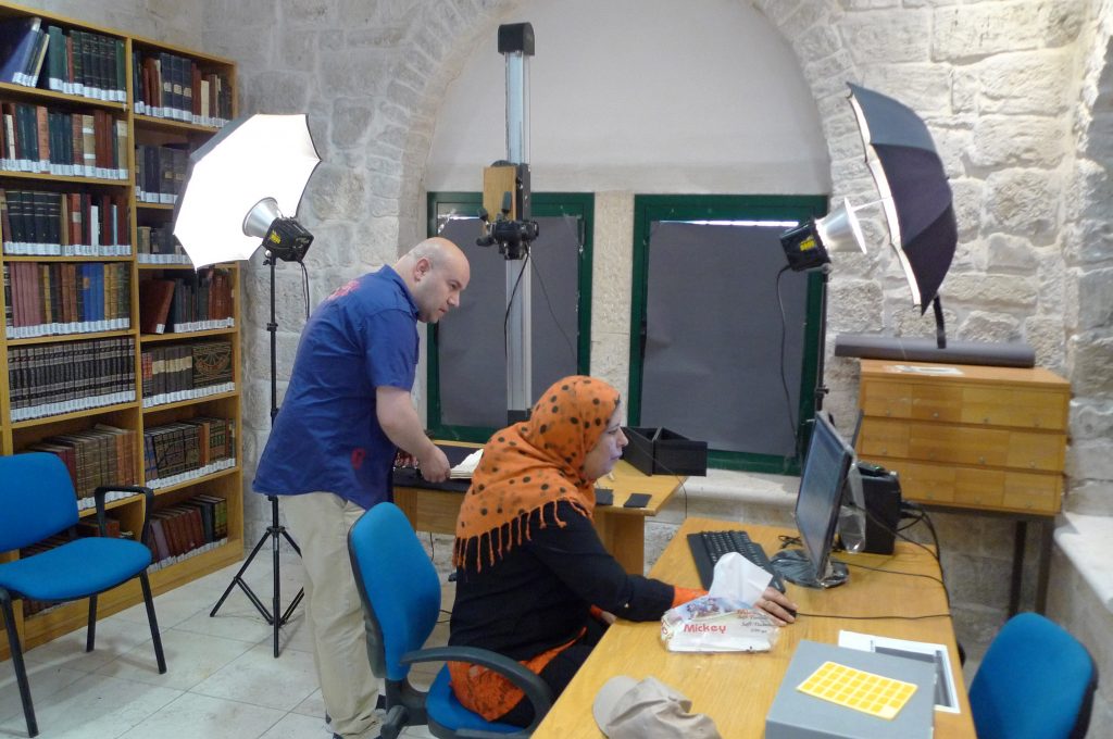 Sheima Budeiry at work digitizing her family’s Islamic manuscript collection in Jerusalem
