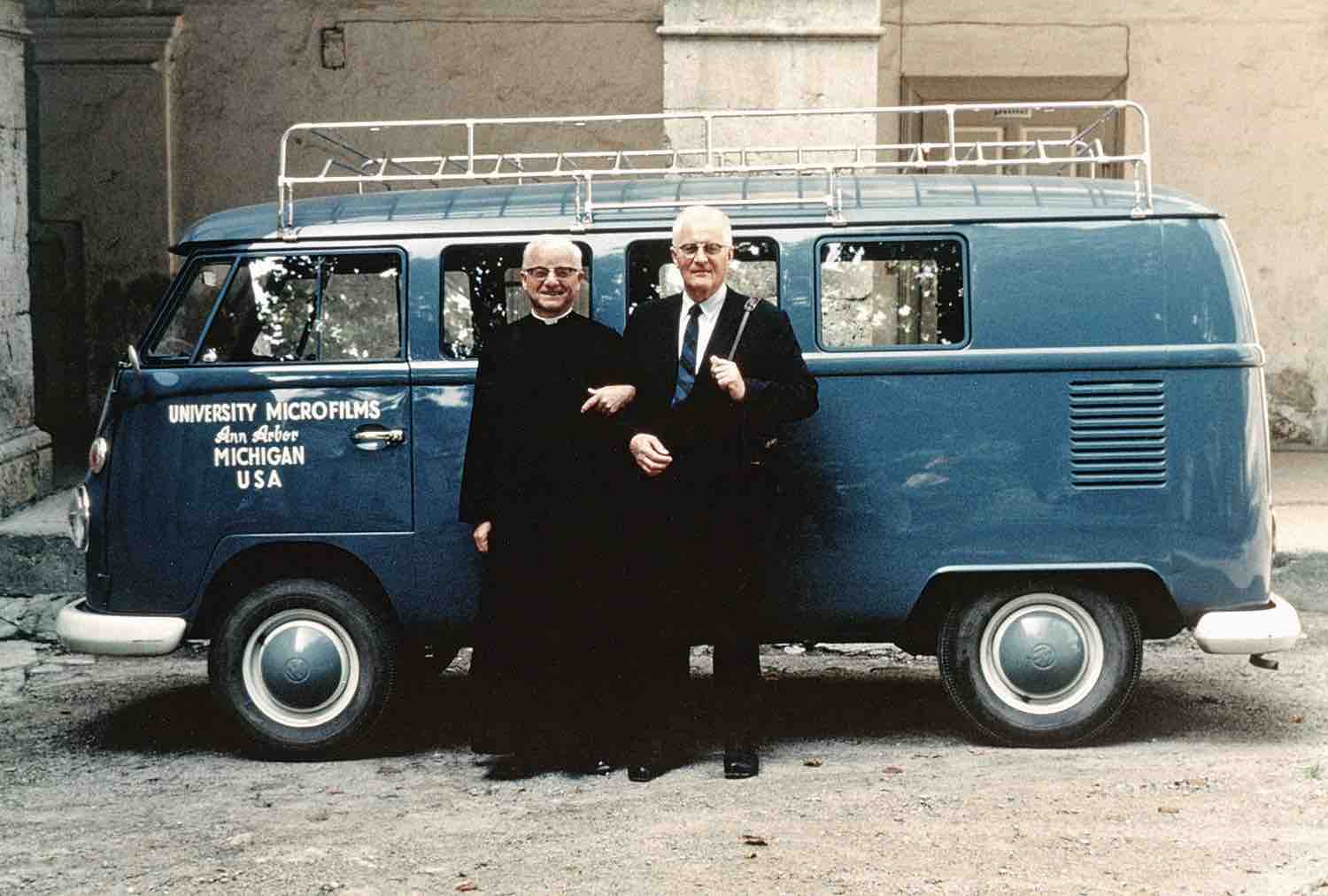 Fr. Oliver Kapsner, OSB, and University Microfilms’ Eugene B. Power with the minibus used to transport microfilm equipment and crew through Austria in the 1960s