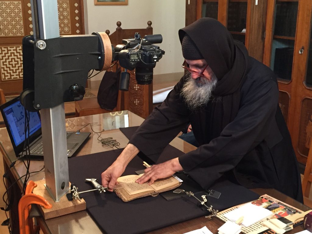 Monk of Saint Macarius digitizing manuscripts
