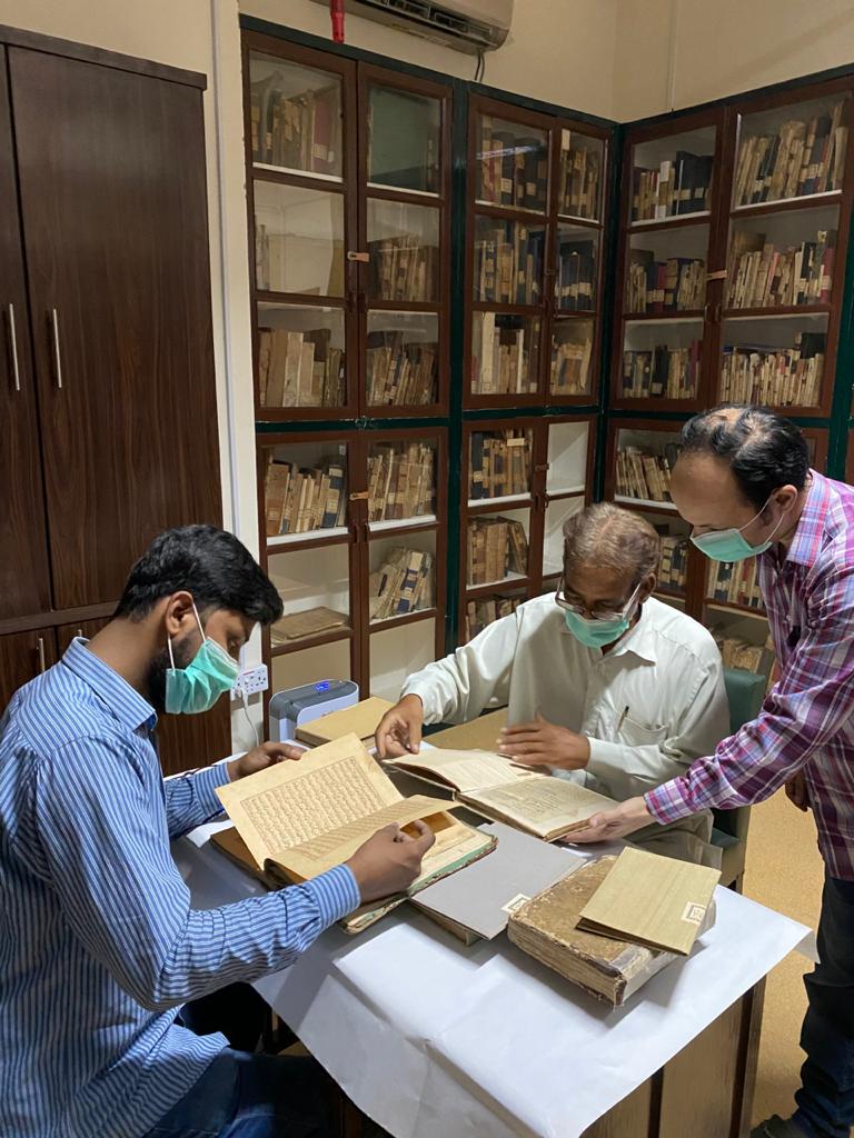 Sorting manuscripts at Anjuman-e-Taraqqi-e Urdu Pakistan, Karachi