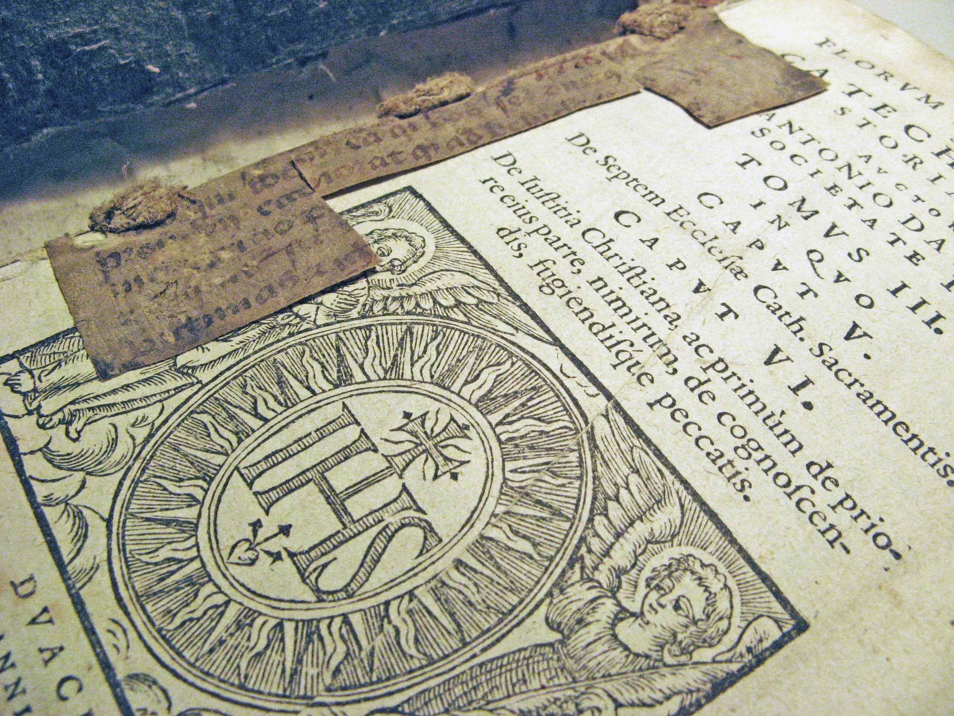 Pieces of parchment manuscript help hold together a printed book